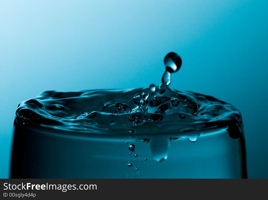 Glass of pure water in a blue tone. Glass of pure water in a blue tone