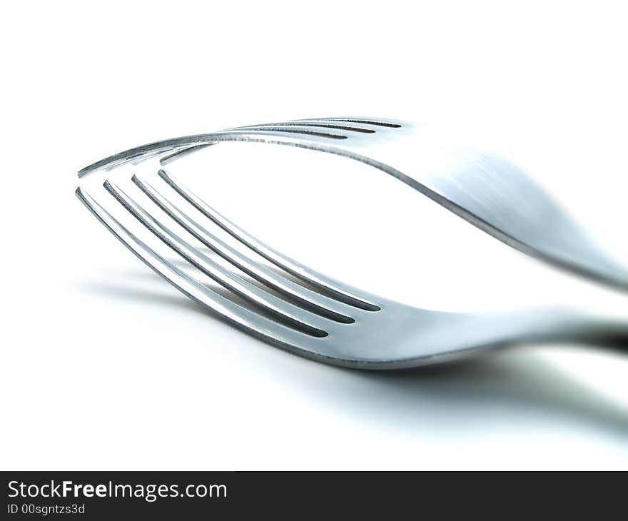 Two forks on a white background