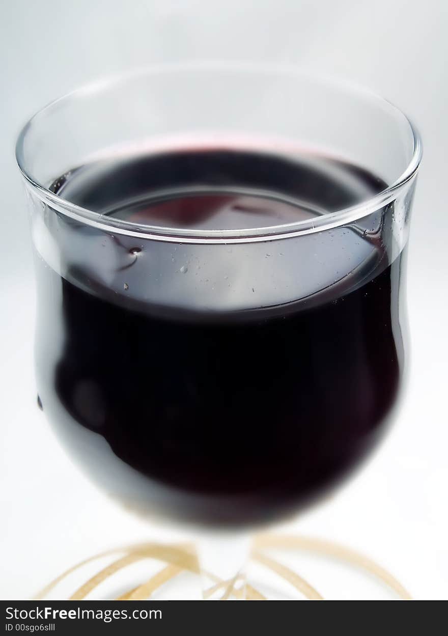 Glass of red wine on a white background