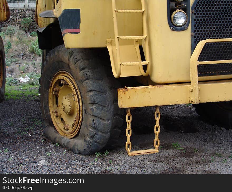 A detail view of an olderr caterpillar truck. A detail view of an olderr caterpillar truck.