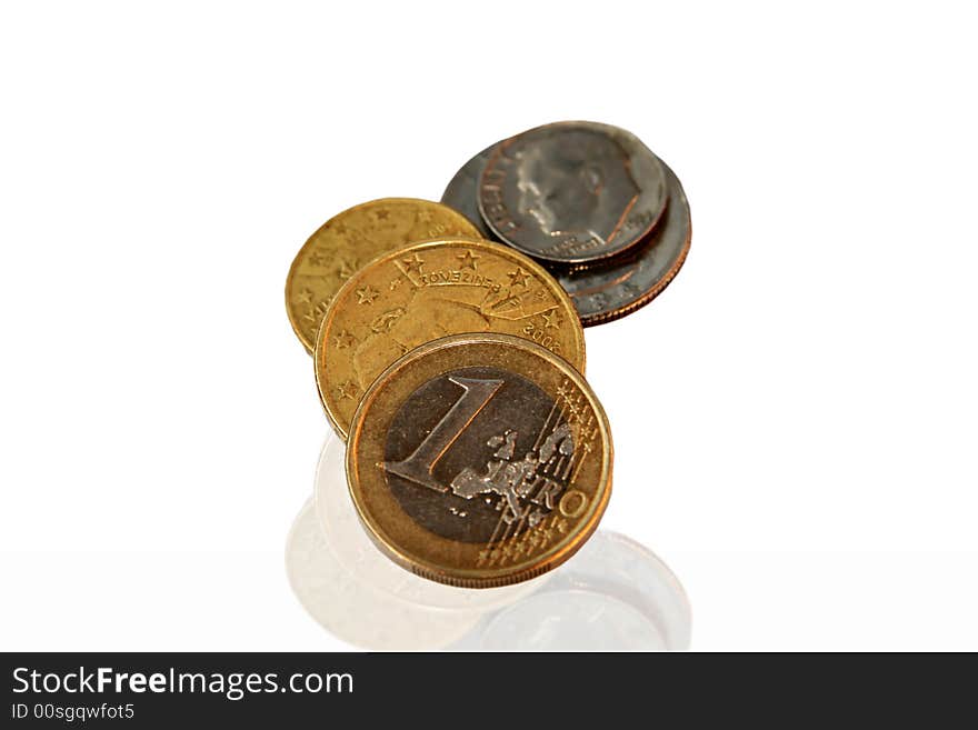 Several euro and U.S.A. coins with mirror reflection isolated. Several euro and U.S.A. coins with mirror reflection isolated