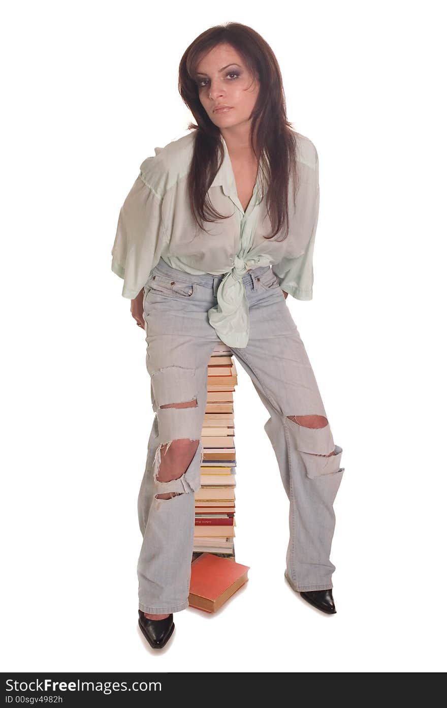 Young student girl with books on white