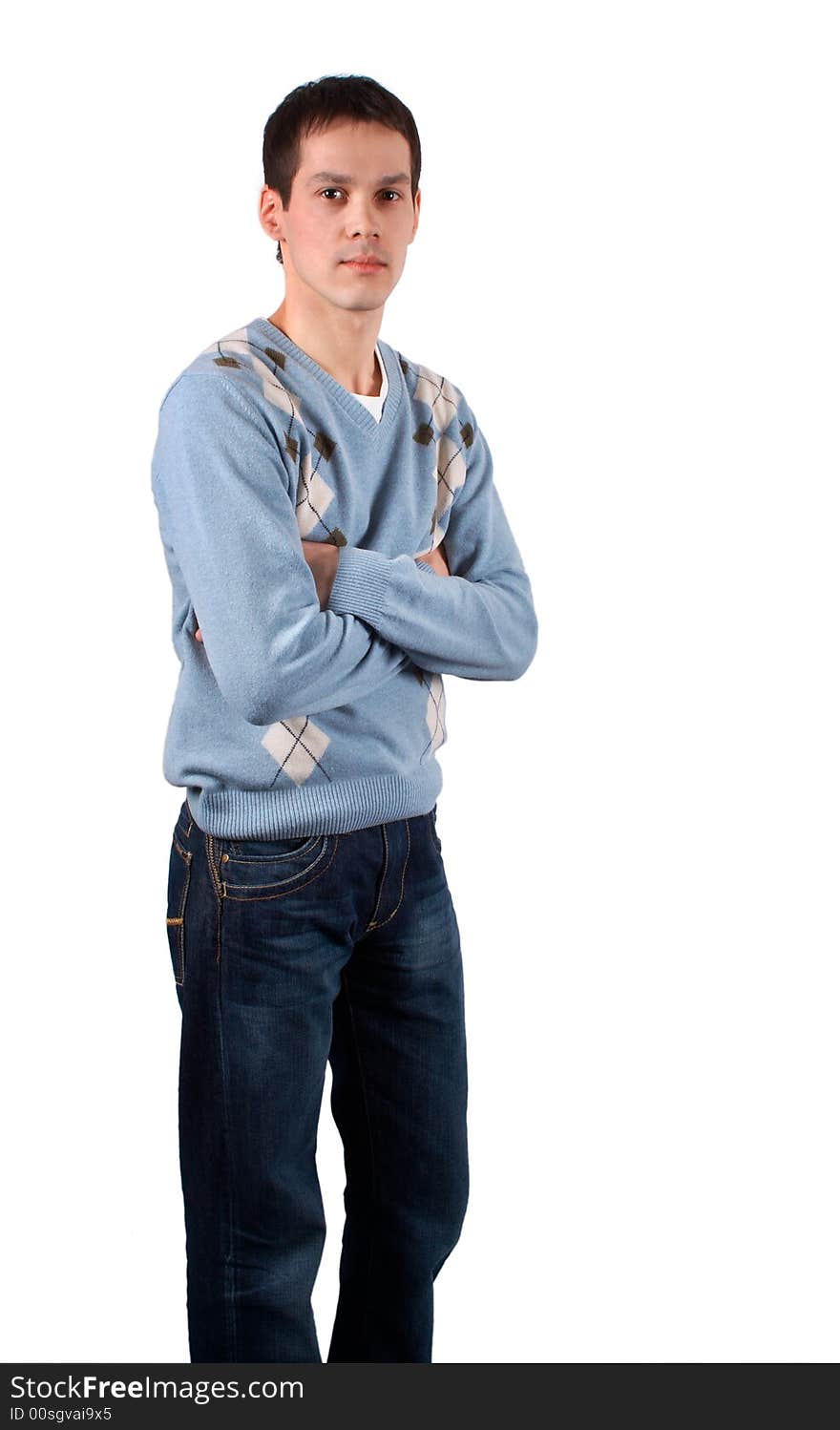 Young man stands cross hands