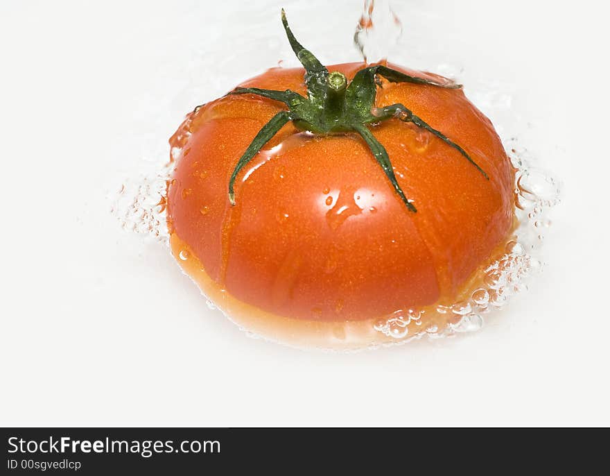 Tomato sunken into water