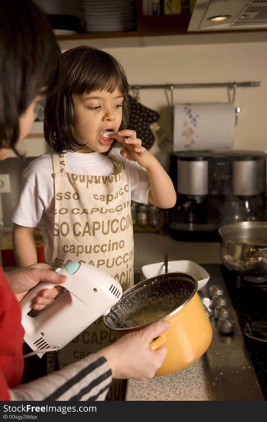 Mother and daughter cooking