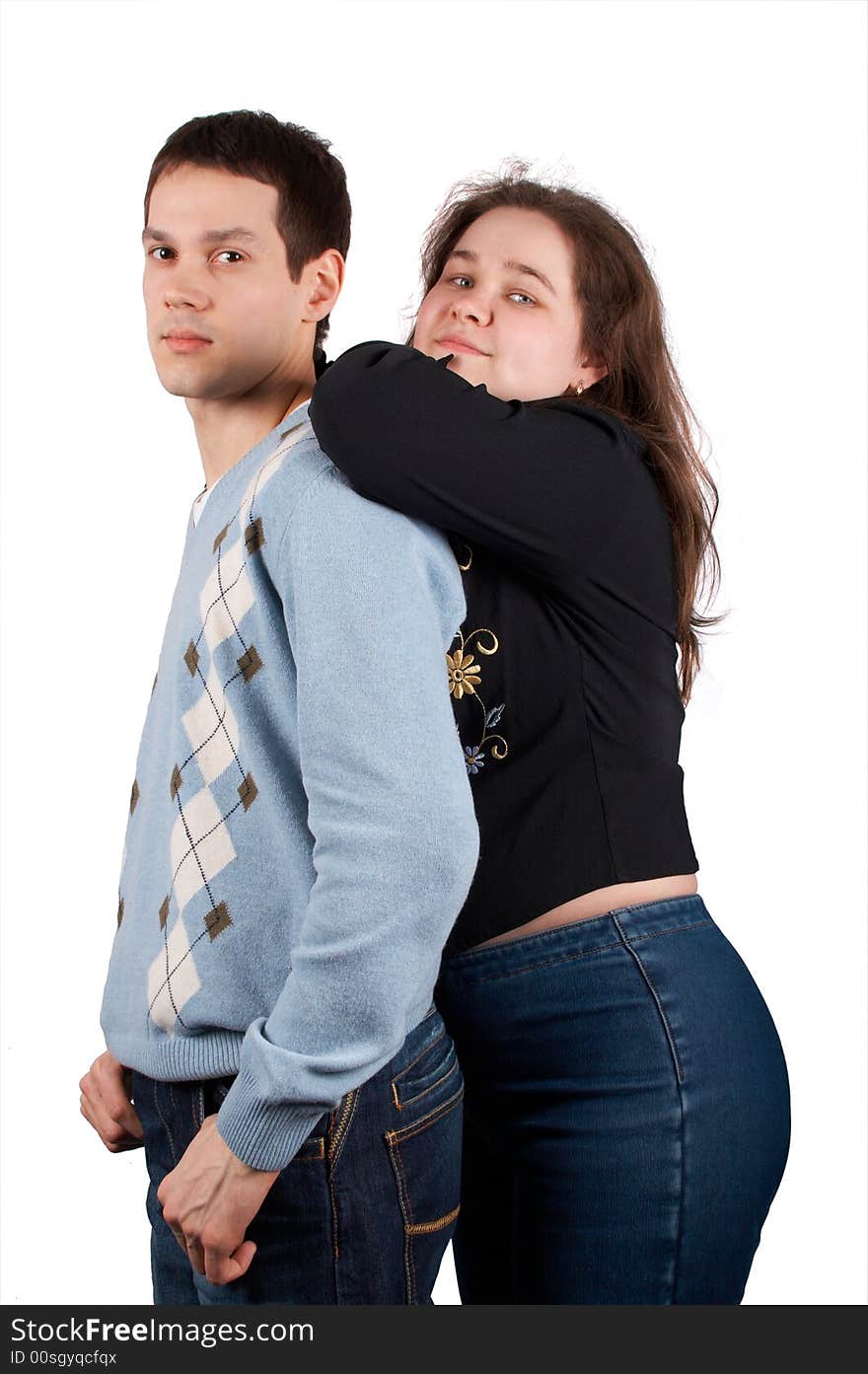 Young man and girl, girl lean at him from behind