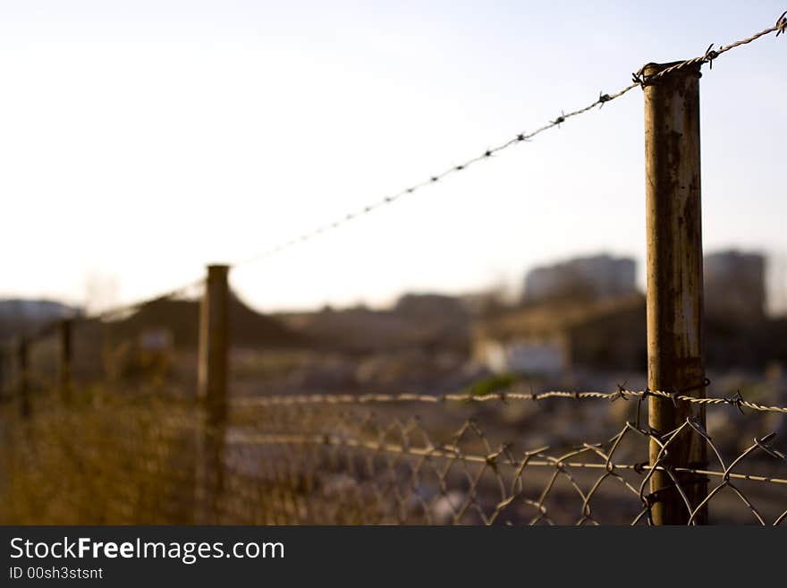 Wall of wires around blurred place. Wall of wires around blurred place