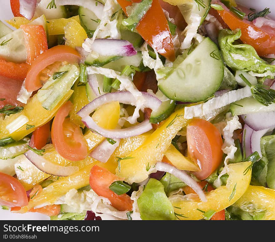 Background from fresh, appetizing vegetable salad. Background from fresh, appetizing vegetable salad.