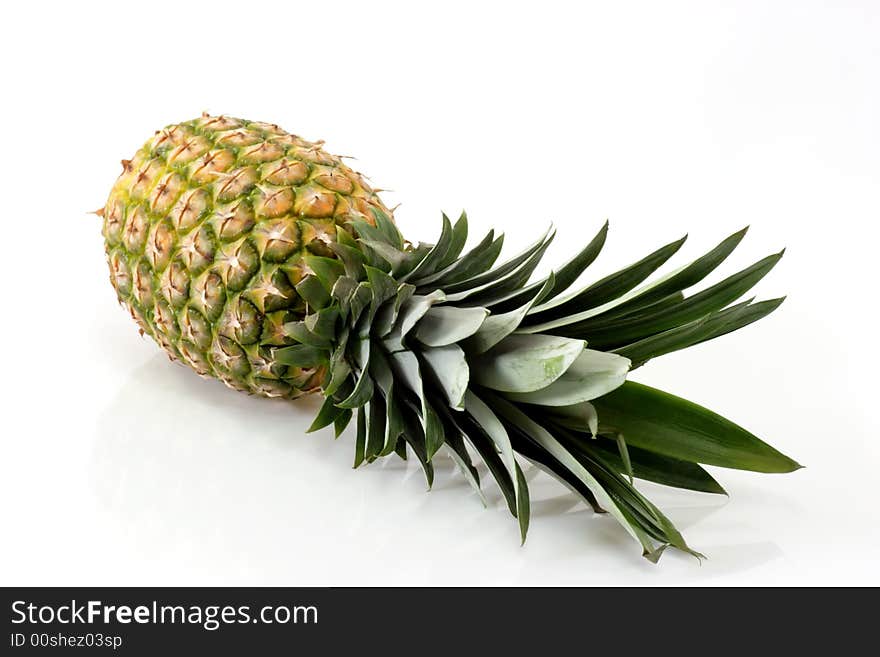 Close up of a fresh pineapple on bright background. Close up of a fresh pineapple on bright background