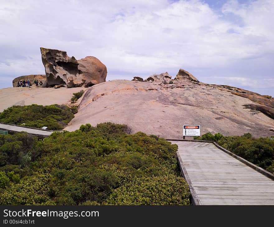 Dusk sets in on a cloudy day at Remarkable Rocks - a natural group of rock formations shaped by erosion of years of sand and surf hitting them. (South Australia)