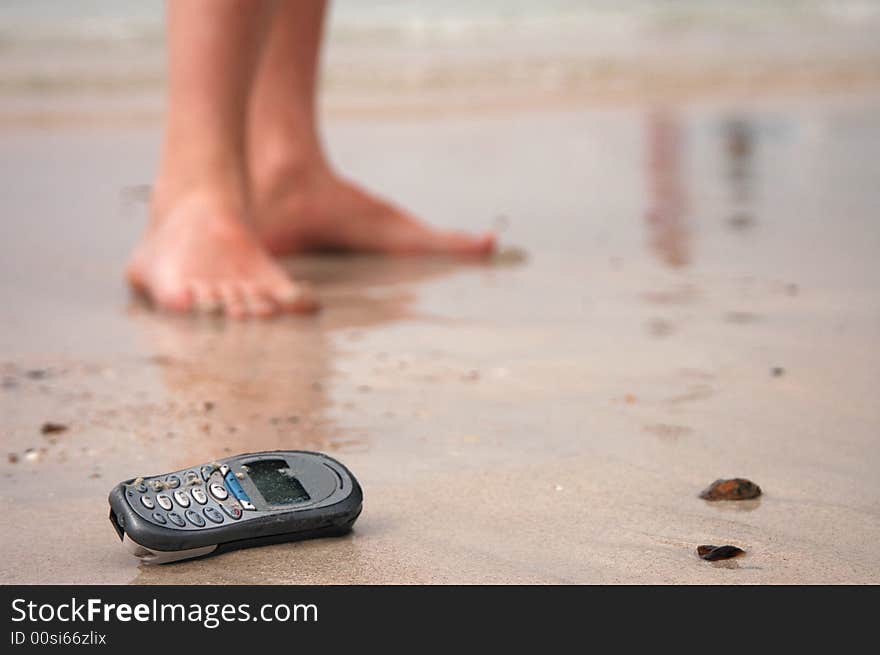 Cellphone in the beach. sand