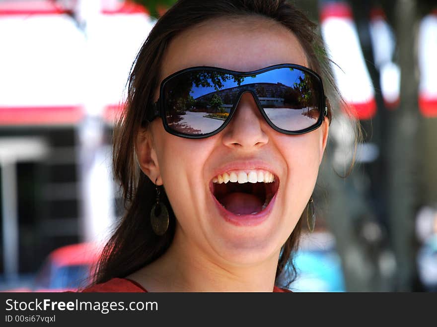 Happy girl walking in the park from the noisy city street. Happy girl walking in the park from the noisy city street