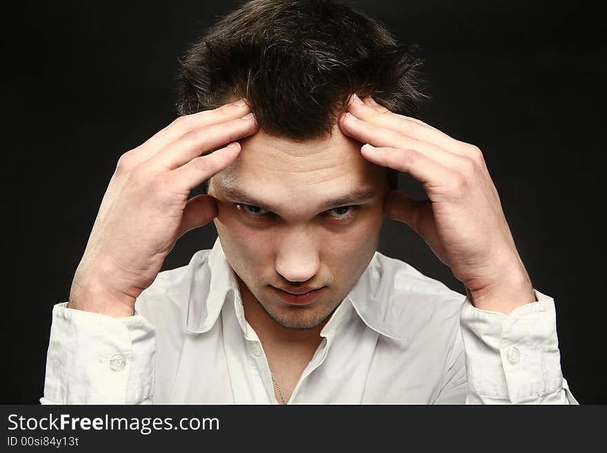 Close-up of a thinking young man. Close-up of a thinking young man