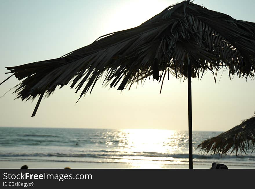 Sunset under umbrella