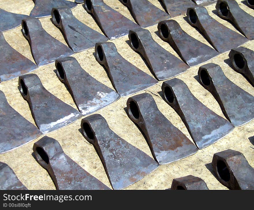 Dangerous set of Axe Blades kept for sale in a market