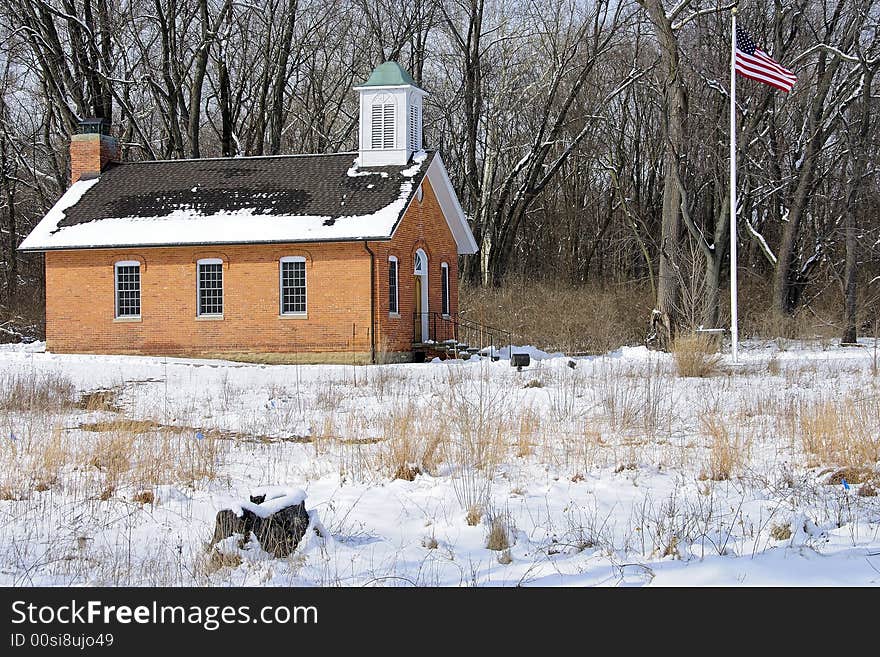 Restored red brick schoolhouse symbolic of basic and classic American education