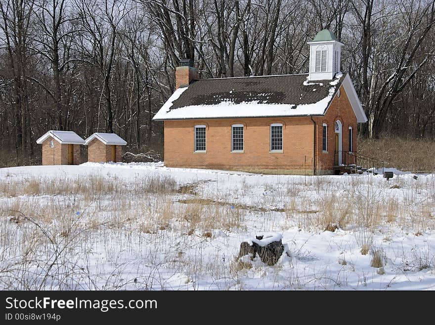 Restored red brick schoolhouse symbolic of basic and classic American education. Restored red brick schoolhouse symbolic of basic and classic American education