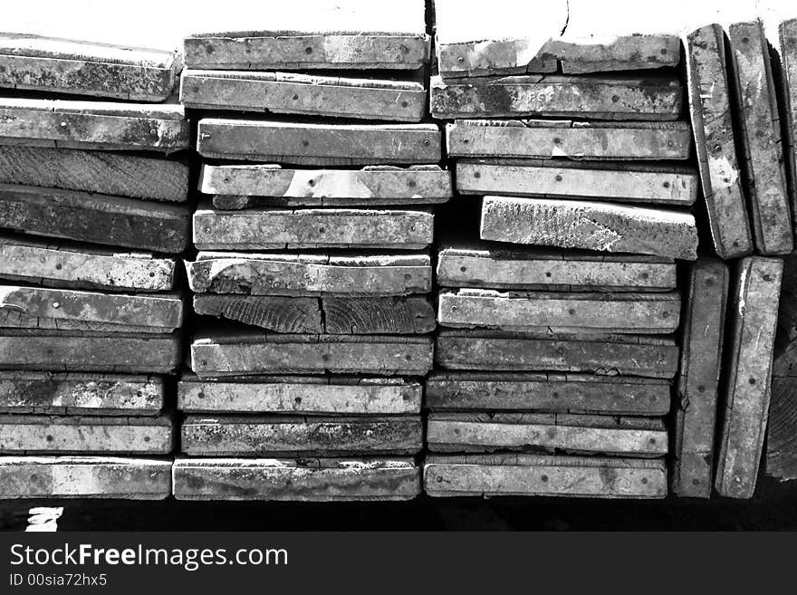 A stack of construction planks used for scaffold looking end on. A stack of construction planks used for scaffold looking end on