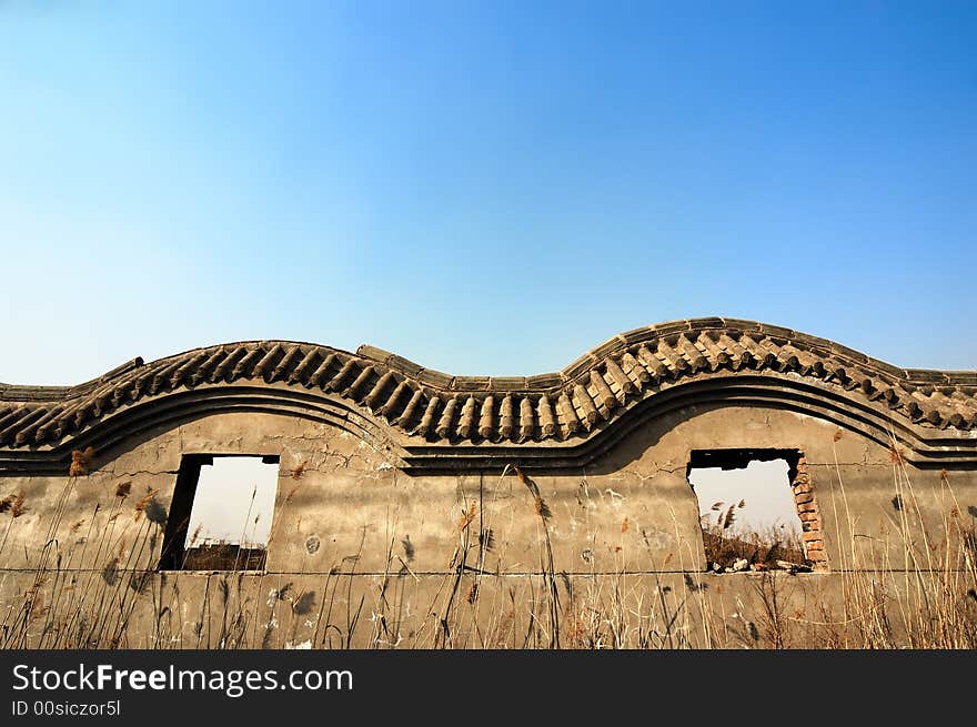 Wall ruins against blue sky