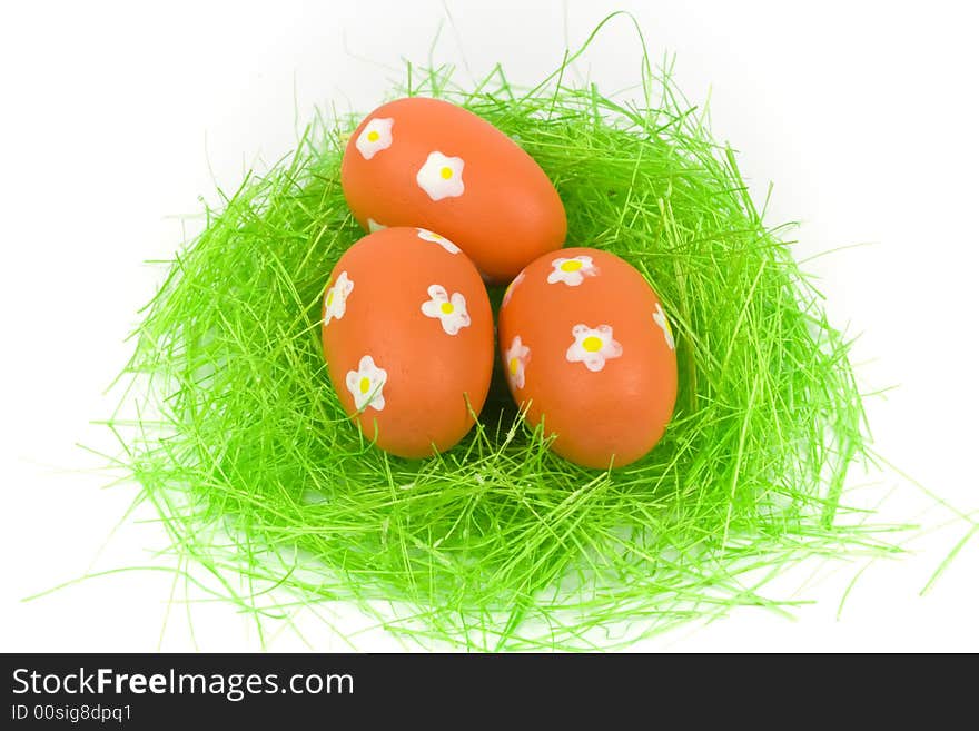 Three Red Easter Eggs With Green Grass