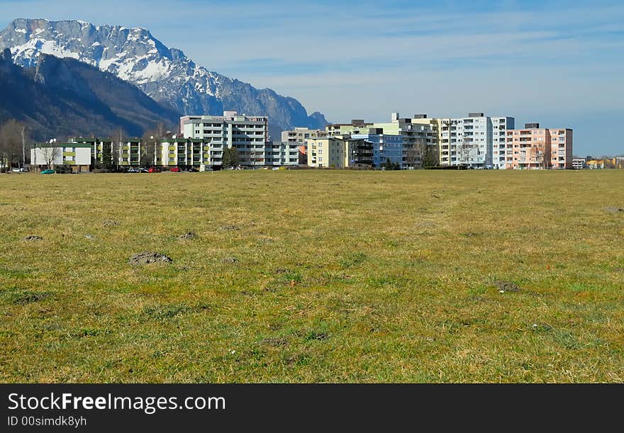 Apartment blocks with mountains no.1