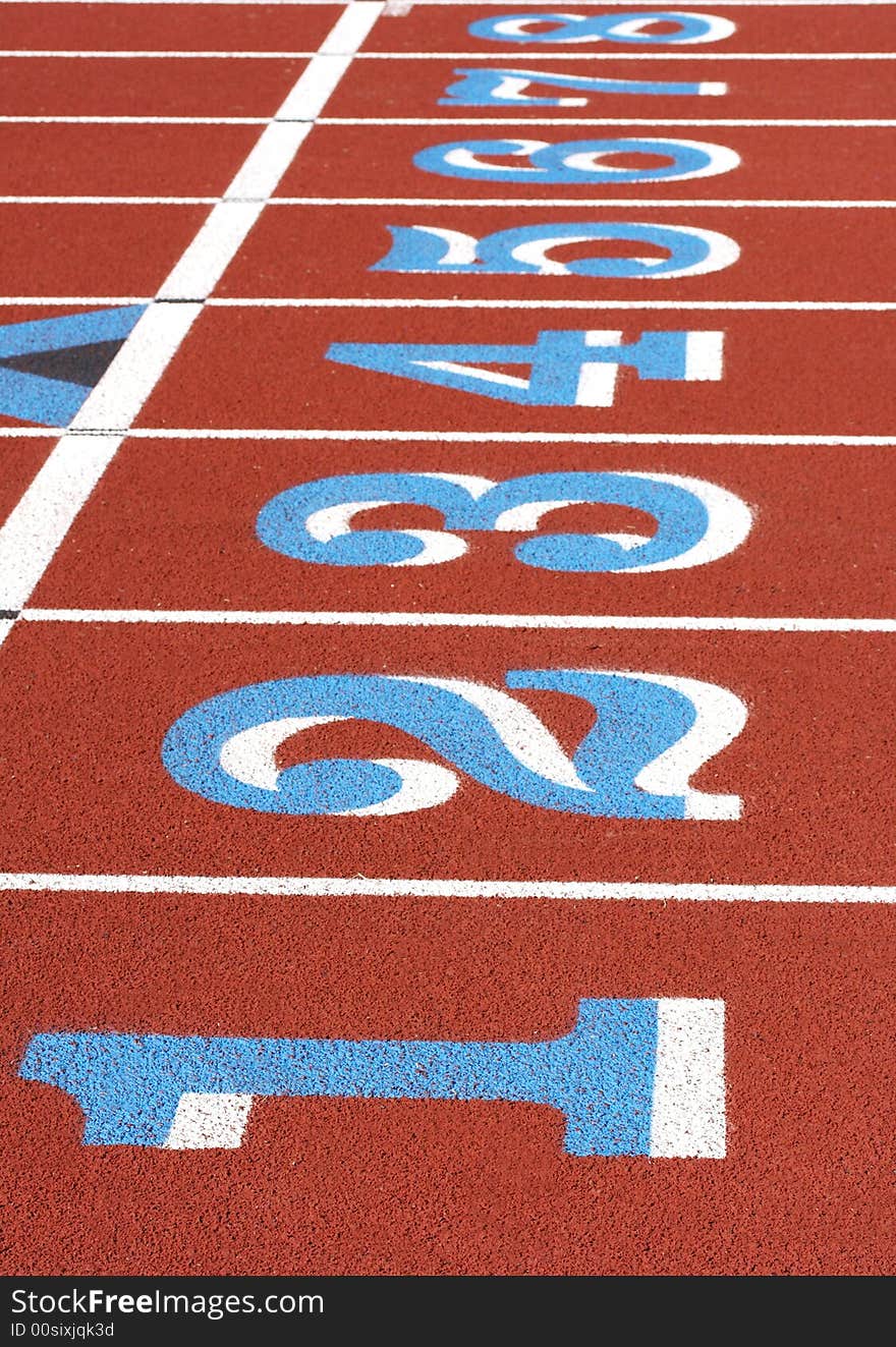 A picture of a track and field venue. A picture of a track and field venue