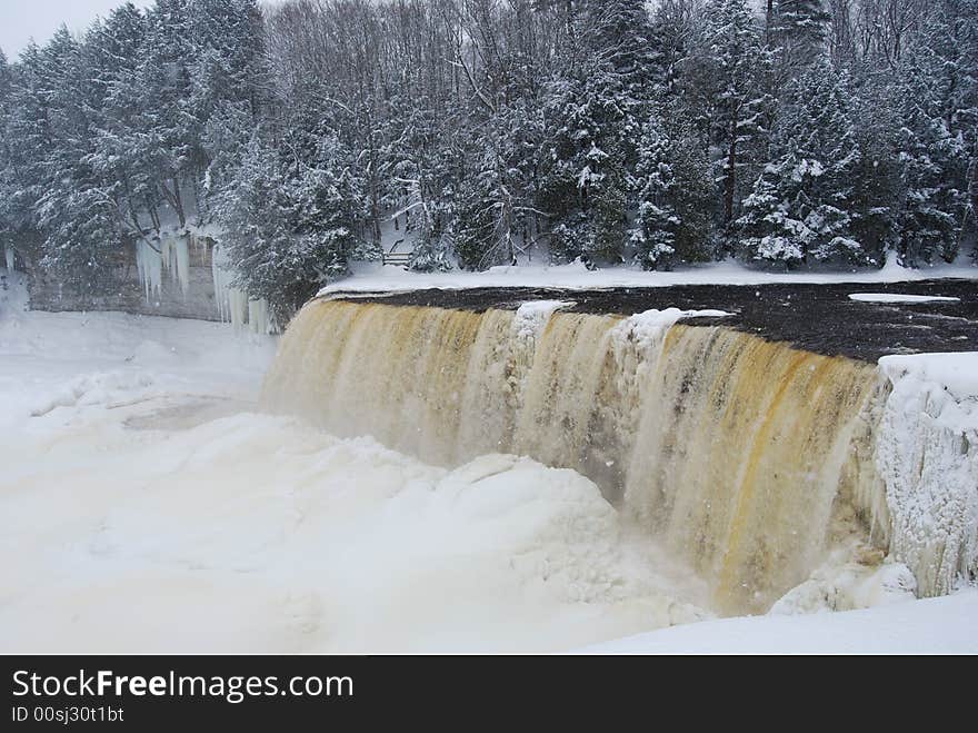 A waterfall partially frozen in the wintertime. A waterfall partially frozen in the wintertime.