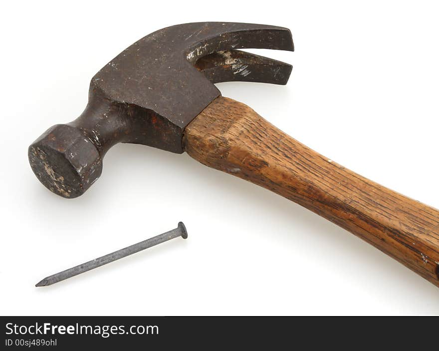 Old vintage hammer and nail for home construction