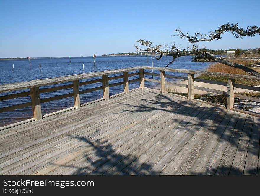 Tree And Large Deck At Shore