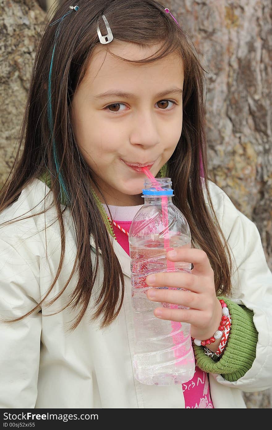 Little girl drinking mineral water. Little girl drinking mineral water