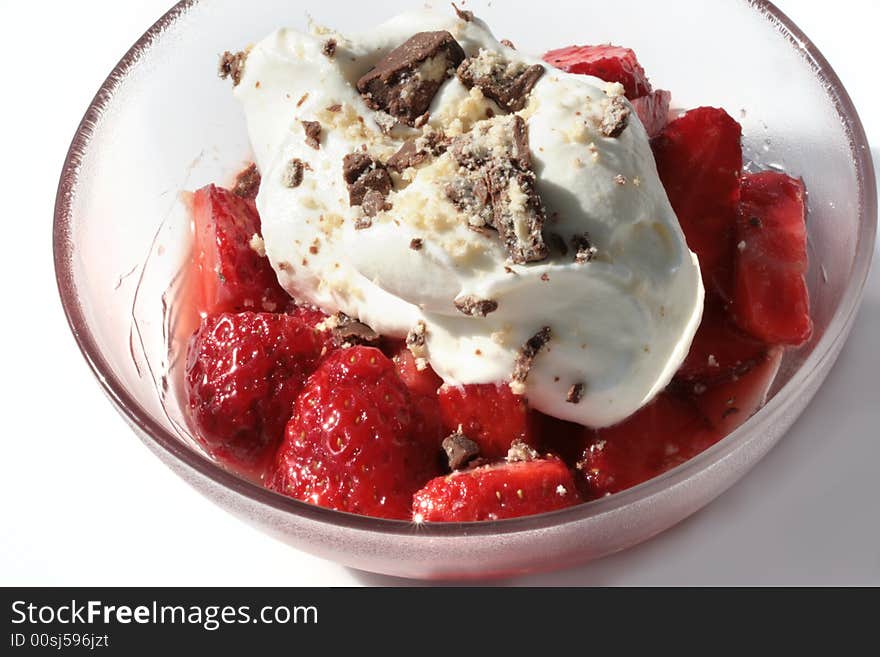 Strawberries with cream sprinkled chocolate biscuits. Strawberries with cream sprinkled chocolate biscuits