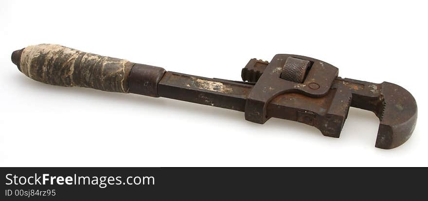 Old vintage taped wooden handle rusty pipe wrench. Old vintage taped wooden handle rusty pipe wrench