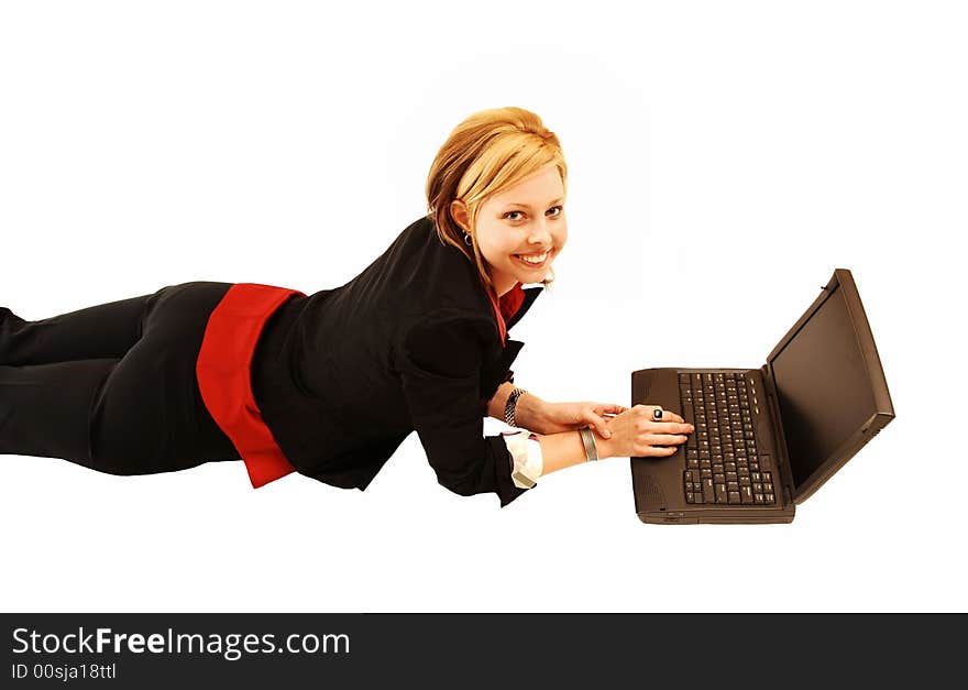 An pretty young lady lying on the floor and working on her laptop. An pretty young lady lying on the floor and working on her laptop.