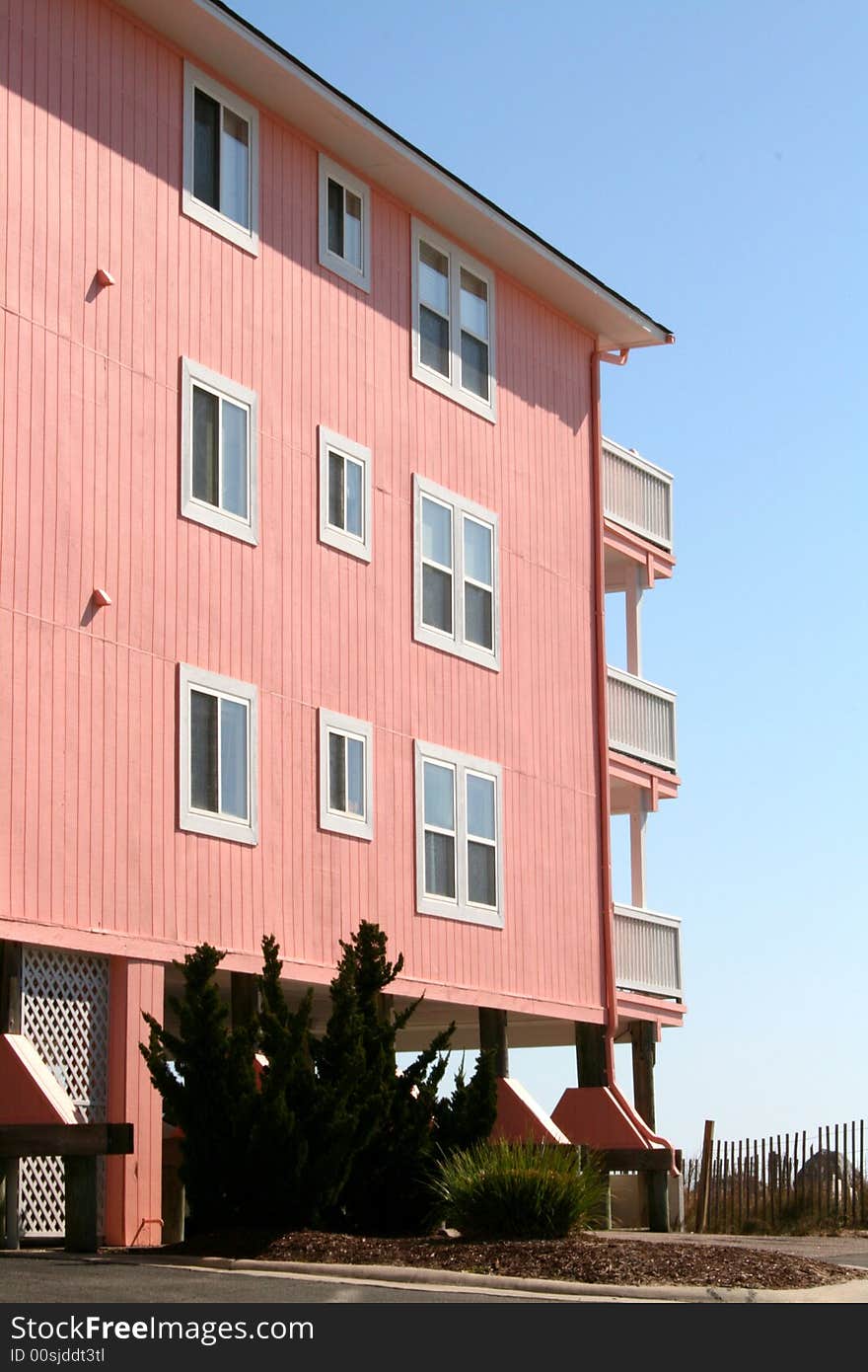 Large modern beach front home with multiple level decks over looking ocean.