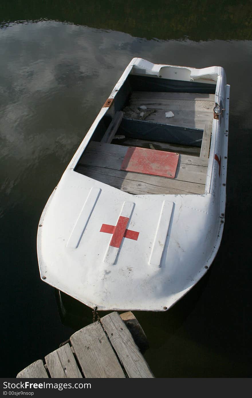 Lisesaver boat on the lake with reflection