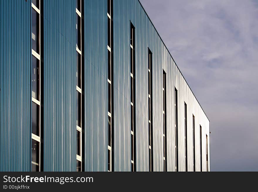 Blue industrial building with much windows. Blue industrial building with much windows