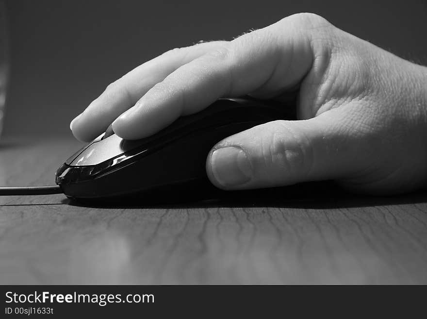 Black and White portrait of computer mouse and hand. Black and White portrait of computer mouse and hand