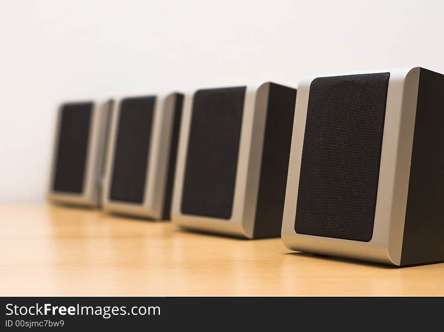 Sound speakers aligned on table