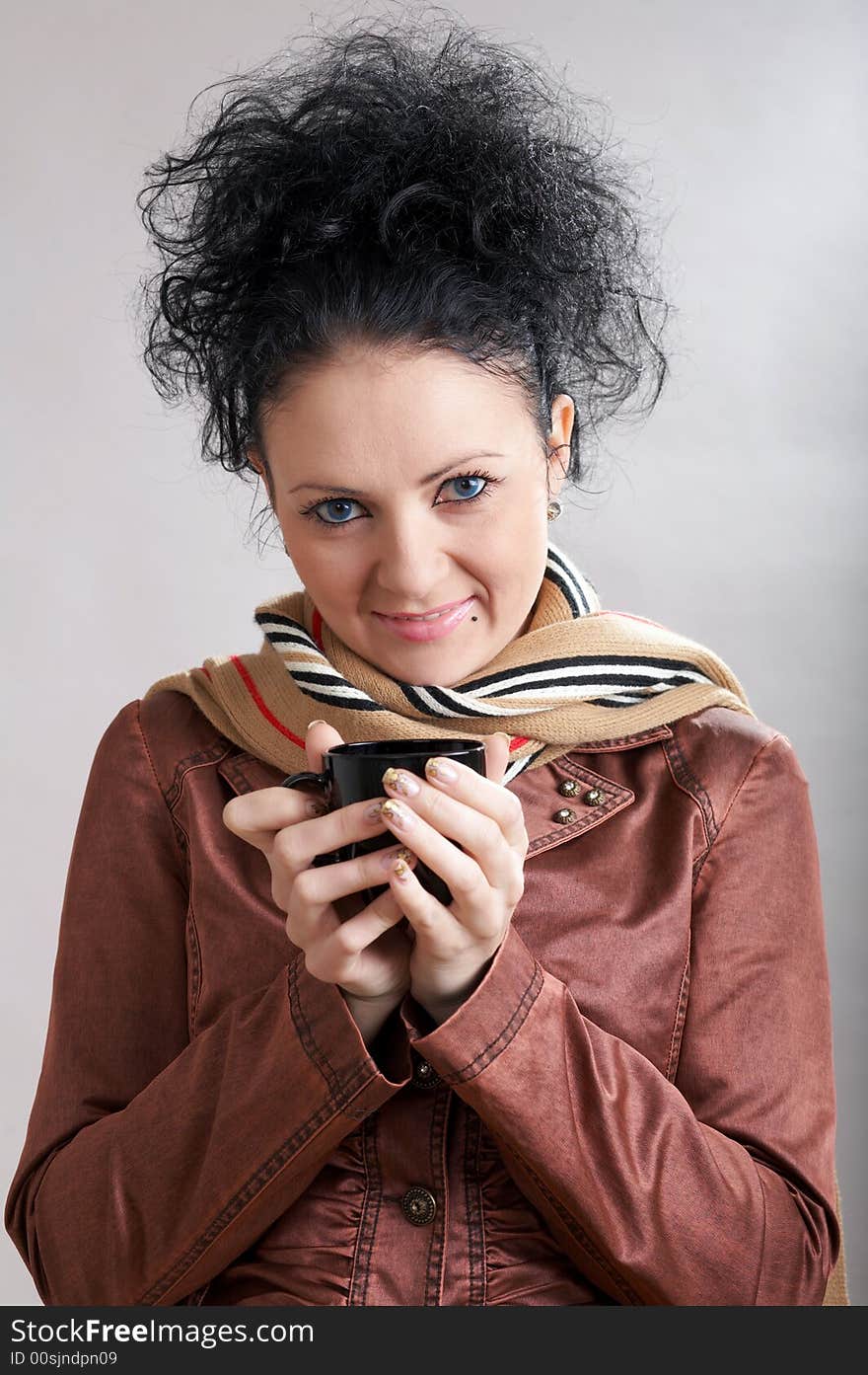 An image of beautiful girl drinking hot coffee