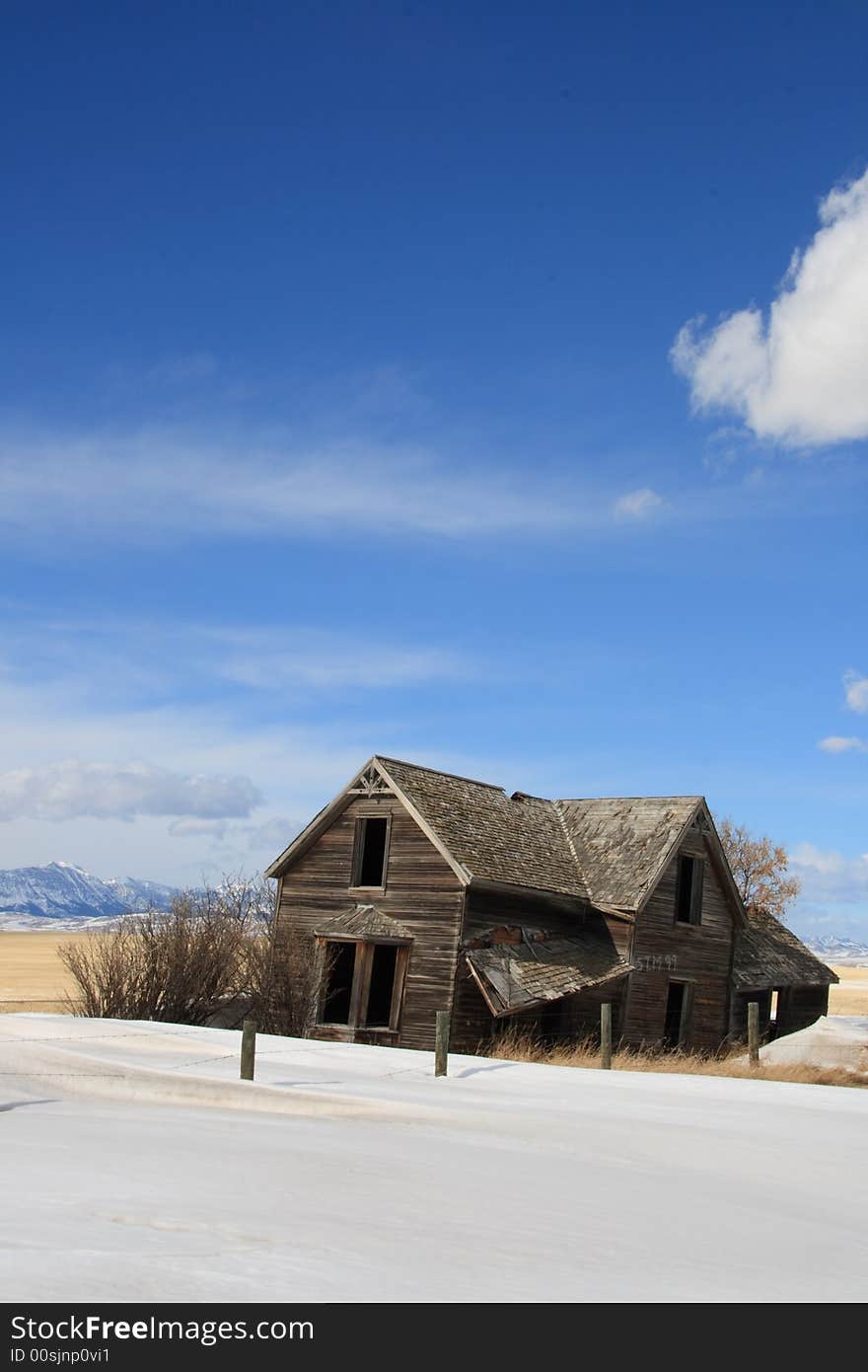 An old abandoned farm house with a great view of the Rocky Mountains. An old abandoned farm house with a great view of the Rocky Mountains