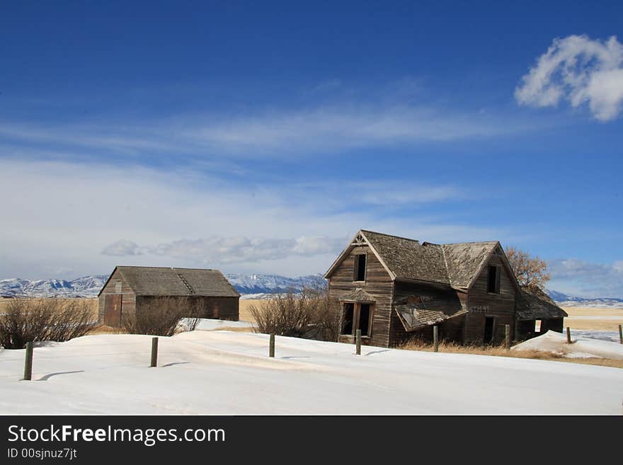 An old abandoned farm house with a great view of the Rocky Mountains. An old abandoned farm house with a great view of the Rocky Mountains