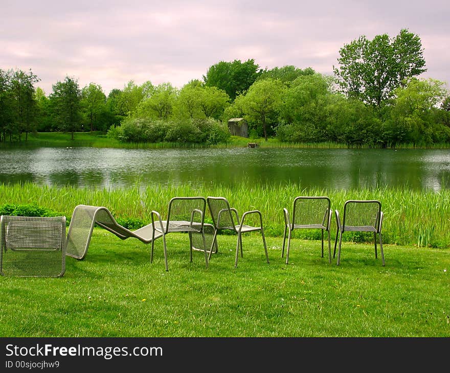 Chairs in park overlooking the lake