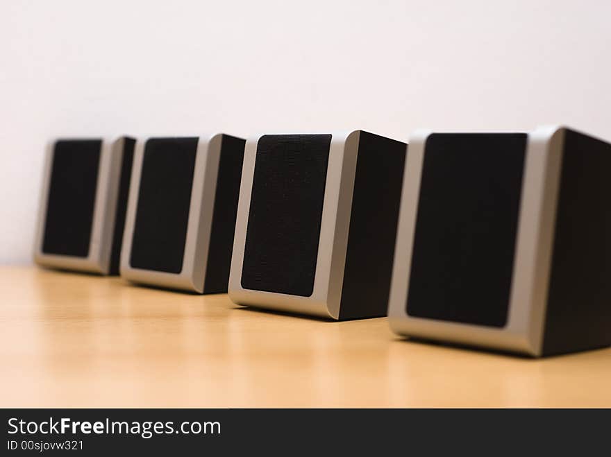 Sound speakers aligned on table