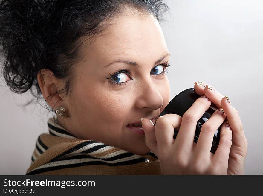 An image of beautiful girl drinking hot tea