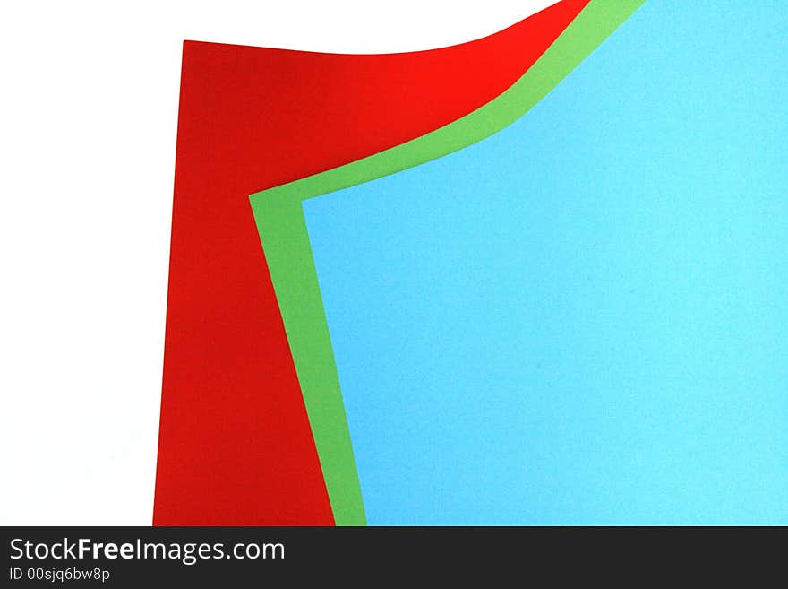 Three different colored pieces of paper. red green and blue. isolated on a white background. Three different colored pieces of paper. red green and blue. isolated on a white background