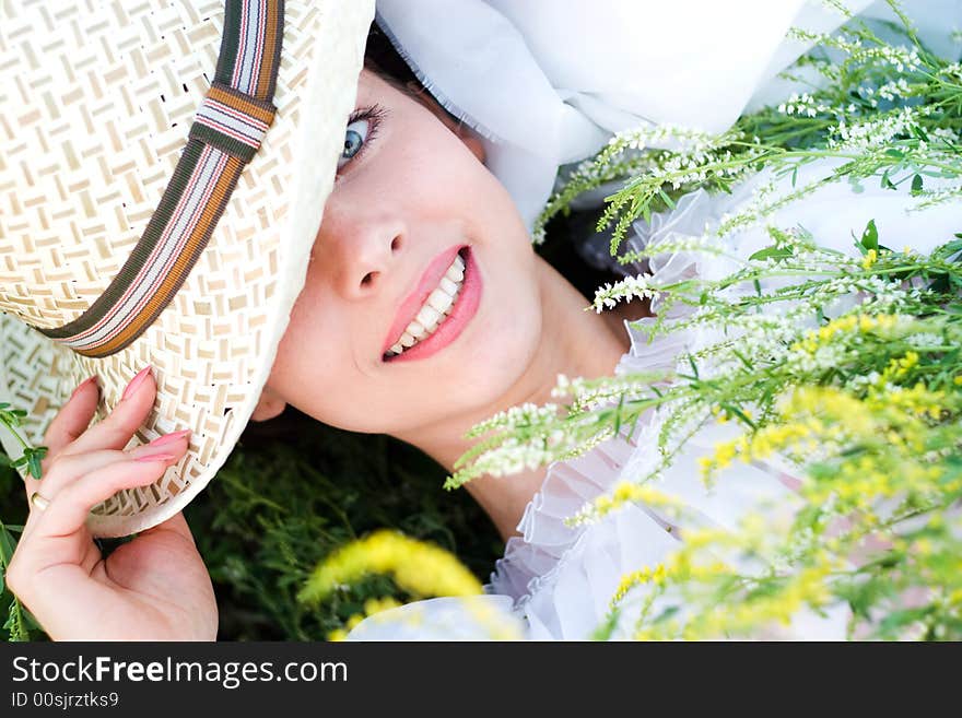 Romantic image of a young woman in a meadow