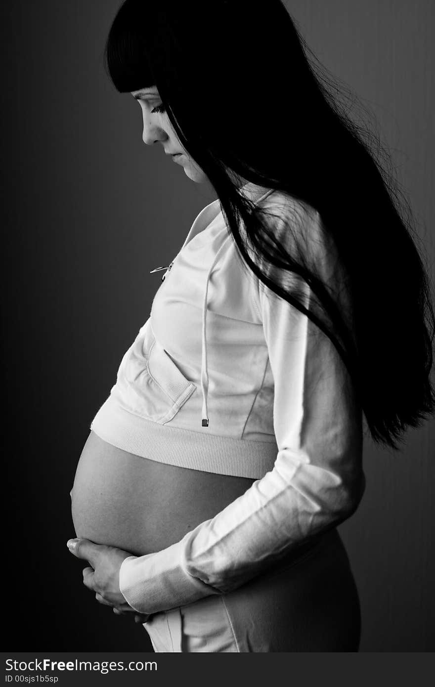 Grayscale image of beautiful pregnant woman