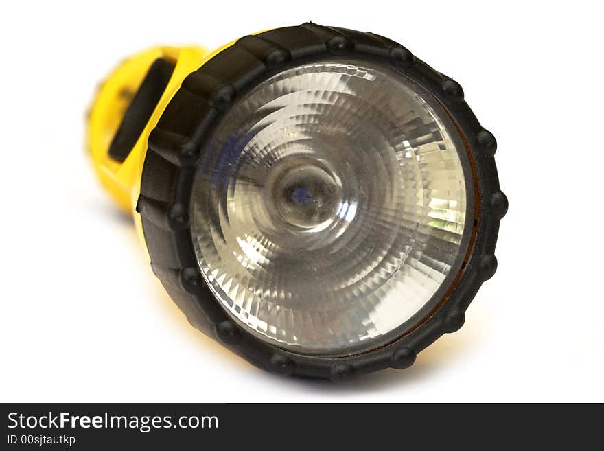 Yellow and black flashlight with white background