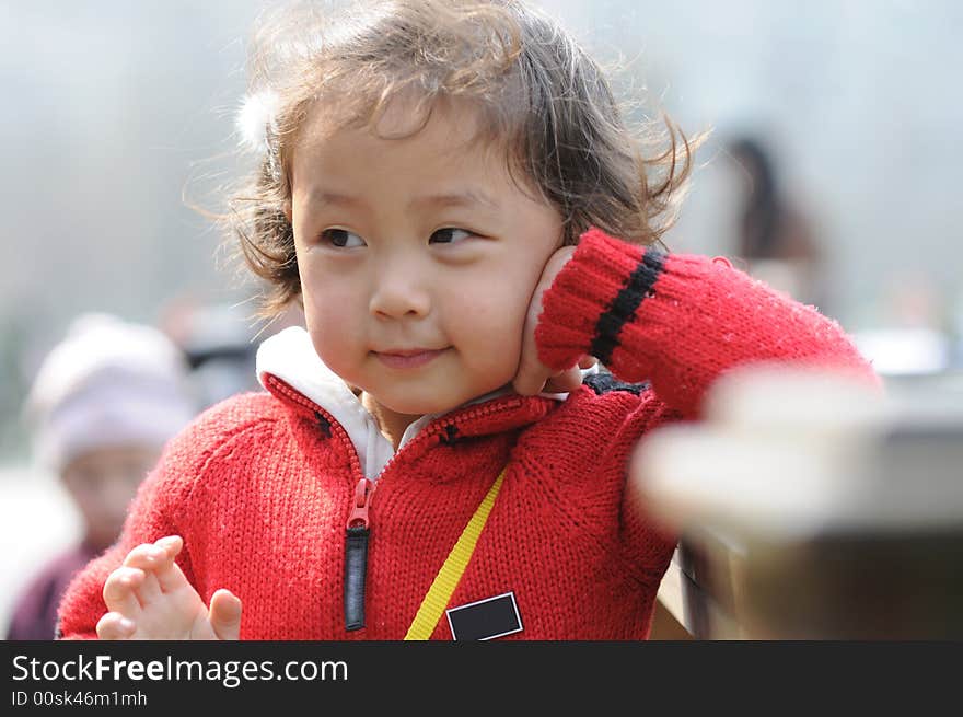 A beautiful girl in red，with smile