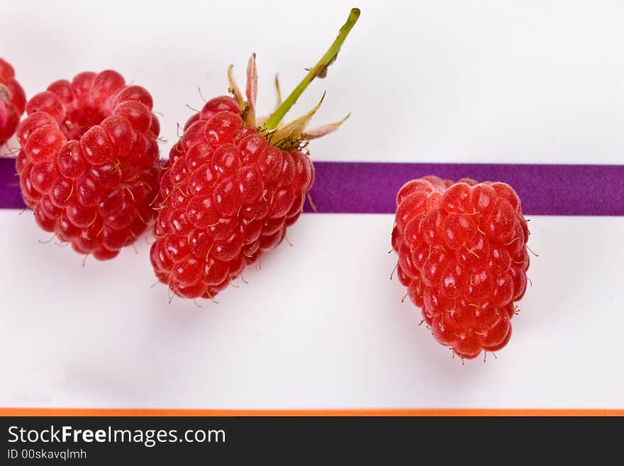 Food series: fresh red raspberry on the strip table